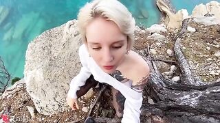 A cute young girl passionately sucks dick on the ocean shore