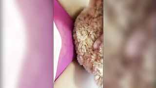 A girl is humping a teddy bear and pretending it’s a horse