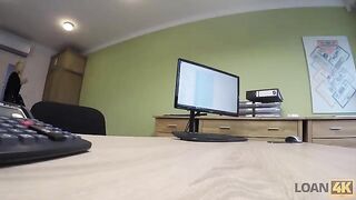 A businesswoman needs a loan and agrees to an intimate encounter in the office