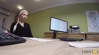 A businesswoman needs a loan and agrees to an intimate encounter in the office