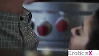 The appetizing couple has a hot sex in the kitchen, showcasing passionate moments