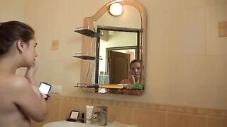 A mature woman with big tits plays with her pussy in the morning