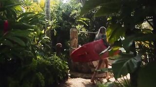 A couple enjoys romantic sex on the beach during their trip
