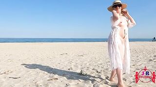 A couple has sex on a public beach, caught by a curious voyeur