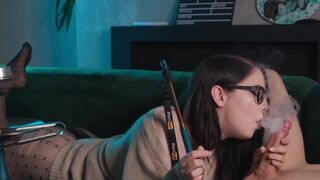 A girl with glasses smokes and sucks cock while getting her pussy eaten in 69