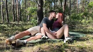 Passionate amateur couple sex in the park on a picnic