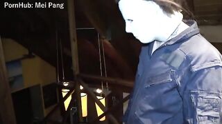 A girl is having fun with a guy in a spooky Halloween setting