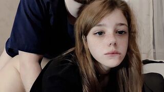 A cute girl is having a good time with her roommate in an intimate setting