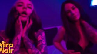 Two girls in a dress have fun with a man and toys