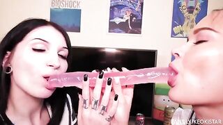 Two lesbian babes play with their juicy pussies using a dildo
