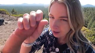 A woman has sex with her boyfriend on the mountain top