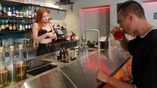 The hot bartender served not only drinks, but also her charms to the customer