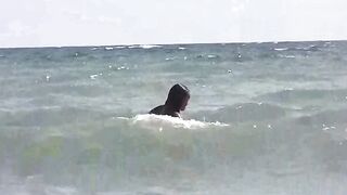 Girls get a tan on a naked beach