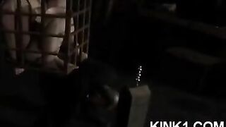 The slave in the cage fulfills all the orders of her master