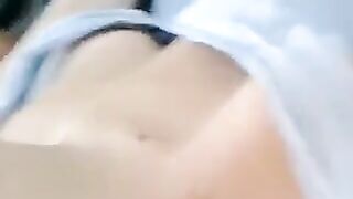 A half-naked lie and caress her body with her hands in this hot vid