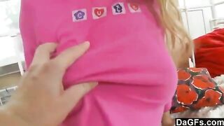 A sweet young blondie plays with her pussy in her panties on the bed