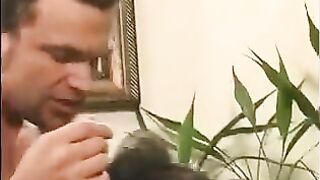 A 40-year-old man playing a joke, touching the nipples of a girl