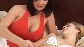 A girl is having fun with her older friend using a strapon
