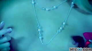 A blonde woman plays with a big dildo and reaches orgasm