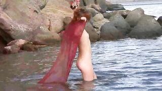 A sexy girl with small boobs gets them wet in a steamy scene