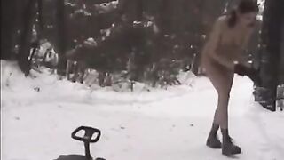 Nude girls are throwing snowballs at each other in the winter