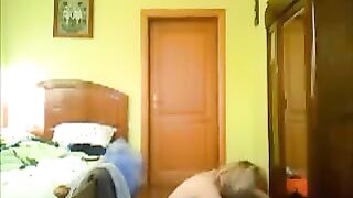 A guy peeps at his home and sees a girl naked
