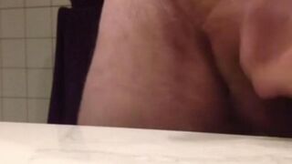 A guy caressed the balls while working at the table
