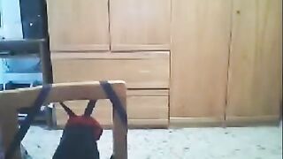 A girl has sex in front of her webcam while her husband is nearby