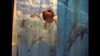 A man secretly shoots his naked wife in the bathroom with a camera