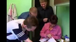 A Russian mother gets fucked by three guys in the kitchen