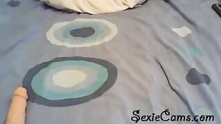 The beauty checks the strength of her new toys on webcam