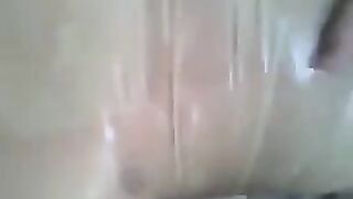 A guy put a condom on his dick and masturbated