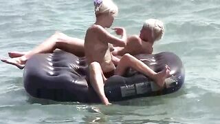 A young girl is having fun naked on the mattress