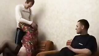 A mature woman fucked with her son and his friend in the hotel