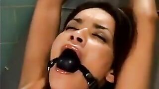 A bald man fucked a girl using a sex machine in hardcore