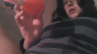 The girl caresses her clitoris with a vibrator in an intense session