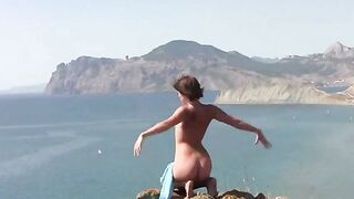 A girl is fond of posing naked on the beach