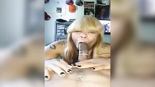 A black woman gave a blowjob to her guy’s cock in a condom, captured in a raw homemade scene