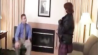 The fat woman in stockings satisfies her boss on the couch