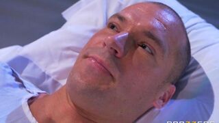 Nurse gave her breast to the patient to suck