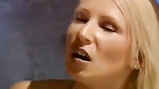 A beautiful girl is tied up and fucked by two men in a hardcore scene