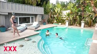 Two students, including Blake Blossom, have outdoor fun by the pool