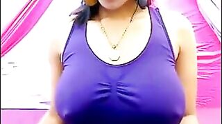The nipples of a excited brunette stick out through her T-shirt