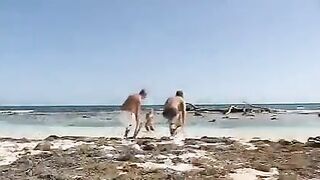 Girl in thongs has sex with two guys on the beach