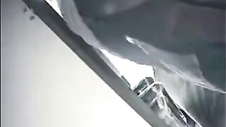 A hidden camera at the checkout shoots girls under their skirts in the store