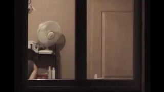 The guy admires himself in the mirror, not leaving anything unshown