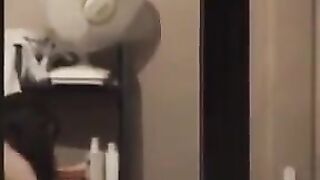 The guy admires himself in the mirror, not leaving anything unshown