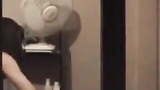The guy admires himself in the mirror, not leaving anything unshown