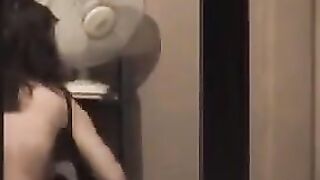 The guy admires himself in the mirror, not leaving anything unshown