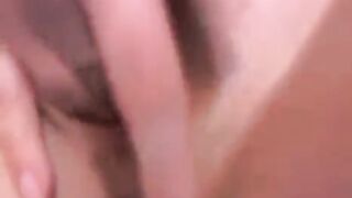 A Russian webcam model with small boobs plays with her pussy on camera